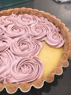 a pie with pink icing on top of it