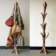 there are two pieces of art made out of tree branches and bags hanging from them