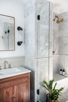 a bathroom with marble walls and floor