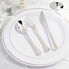 a white plate topped with two silverware