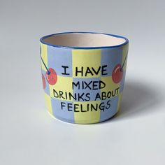 i have mixed drinks about feelings mug with cherries on yellow and blue striped background