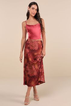 From your favorite ballet flats to strappy sandals, the Lulus Sleek Proposition Rust Floral Satin Bow Midi Skirt is ready to be paired to perfection! Glossy woven satin boasts a bold floral print and faded accents as it shapes this ultra-chic skirt that has a high, elasticized waist with subtle scalloped trim and a dainty ribbon bow at the center. The figure-skimming slip silhouette continues into a classic A-line skirt with a sweet midi hem. Fit: This garment fits true to size. Length: Mid-calf