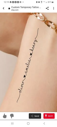 a woman's arm with the words tattoo on it