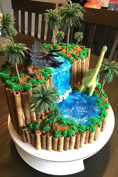 a cake made to look like a waterfall and palm trees