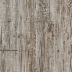 wood flooring that looks like it has been made from old planks and is very rustic