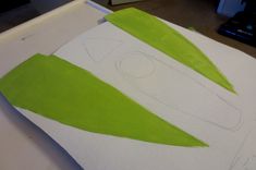 a piece of paper that has been drawn with green tape