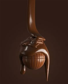 the chocolate sculpture is shaped like an elephant's head and has long, slender legs