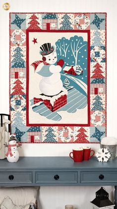 a wall hanging with a snowman on it