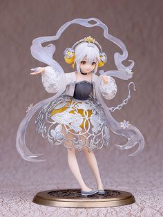 a figurine is shown with white hair and an elaborate dress, holding her arms out