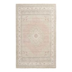 a beige rug with an intricate design on the front and back side, in neutral tones