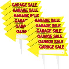 a set of five yellow signs with garage sale written on them