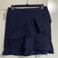 New Aritzia Sunday Best Whitney Ruffled A-Line Mini Skirt New With Tags Color: Navy Blue Size 6 It Could Be You, Or Someone You Know. This Is A Ruffled, A-Line Mini Skirt With A Tailored Waist. It's Made With A Stretchy Cotton Blend Fabric. Invisible Zip Closure Rise: Mid Length: Mid-Thigh Content: 97% Cotton, 3% Elastane. Stock Image To Demonstrate Style & Fit. Color For Sale Is Blue. Blue Ruffle Skirt, Aritzia Skirt, Green Plaid Skirt, Pleaded Skirt, Coral Skirt, Floral Skater Skirt, Olive Skirt, Plaid Pleated Mini Skirt, Ruffled Mini Skirt