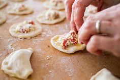 a person is kneading some food on a table