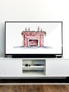 a flat screen tv sitting on top of a white entertainment center next to a wooden floor