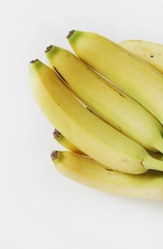 a bunch of bananas sitting on top of each other