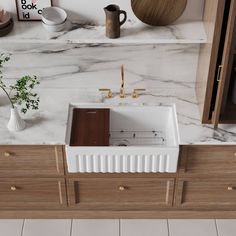 a white sink sitting on top of a wooden cabinet