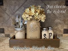 mason jars and utensils are arranged in a wooden tray with the words, you choose the colors