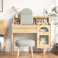 a wooden desk with a mirror and stool