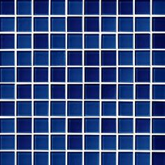 a blue tile wall that is very close to the ground and has squares on it