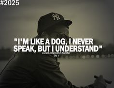 a man wearing a baseball cap and glasses with the words i'm like a dog, i never speak, but i understand