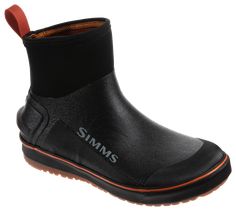 a pair of black boots with orange soles