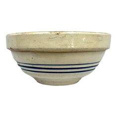 a white bowl with blue stripes on the rim and bottom, sitting in front of a white background