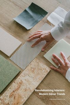 a person is working on some wood flooring with their hand and fingers touching it