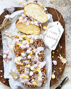 a wooden tray topped with lots of different types of bread and marshmallows