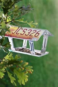 a bird feeder hanging from a tree branch