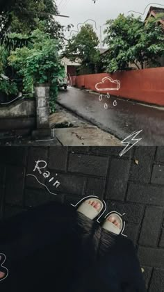 someone's feet are drawn on the ground in front of an alleyway with trees and buildings