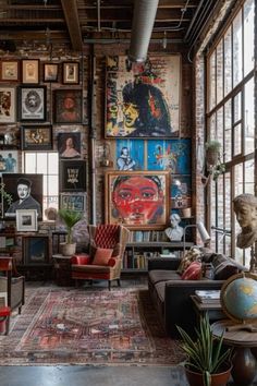 a living room filled with lots of furniture and pictures on the wall next to large windows