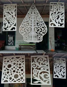 four different views of an intricately designed wall panel with flowers and leaves on it