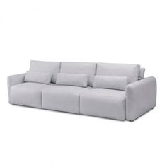 a white couch with four pillows on it