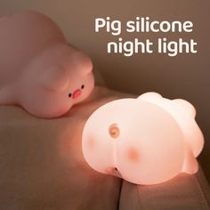 a light that is on top of a couch with a stuffed animal next to it