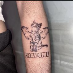 a man with a tattoo on his arm that says pray me and an elephant holding a baseball bat