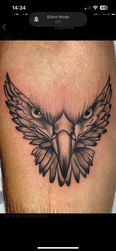 an eagle tattoo on the thigh