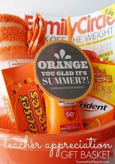 an orange basket filled with candy and other items