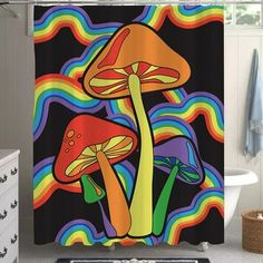 a colorful shower curtain with two mushrooms on it