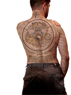 the back of a man with tattoos on his chest and arms, standing in front of a white background