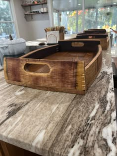 a wooden tray sitting on top of a counter