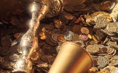 a close up of coins and a pipe