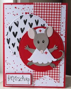 a card with a mouse in a dress on it's front and bottom corner