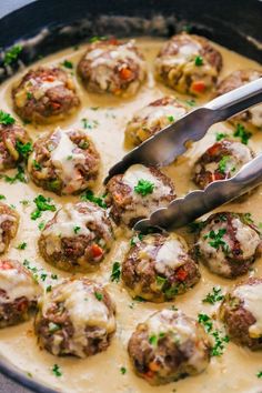 a skillet filled with meatballs covered in gravy