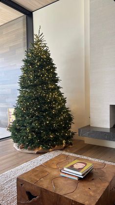 a living room with a christmas tree in the corner