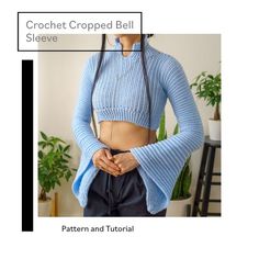 a woman wearing a blue cropped sweater with her hands on her hips and the text crochet cropped bell sleeve