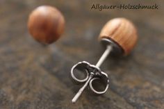 two pairs of silver and wood stud earrings