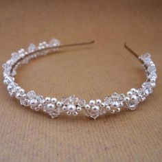 a close up of a headband made out of pearls and crystal beaded beads