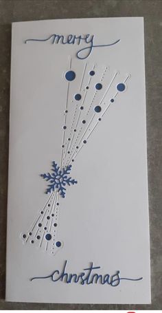 a christmas card with snowflakes on it