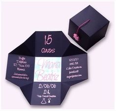 an open black box with some writing on it and a graduation cap in the top right corner