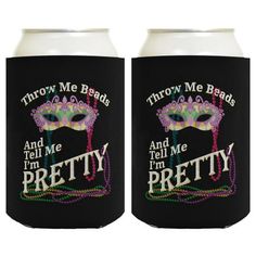 two black can coolers with mardi gras masks and words on the side